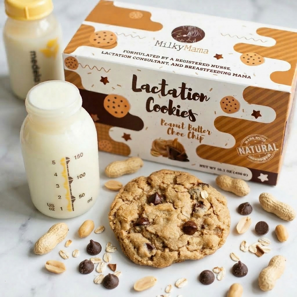Lactation cookies with a box labeled 'Milky Mama' on a marble surface with a bottle of milk.